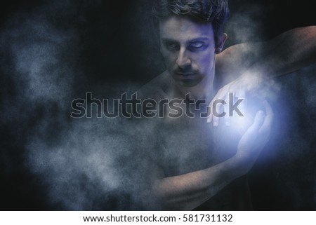 Powerful dark sorcerer casting a spell, making a magic orb