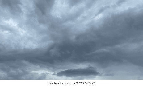 A powerful and dramatic sky with dark, turbulent, and brooding storm clouds.
