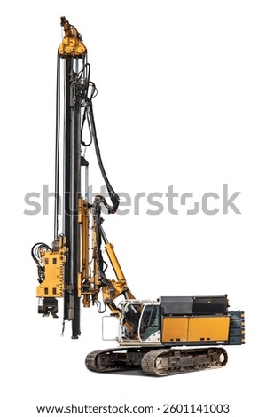 A powerful drilling rig is designed for deep excavation or foundation work. Pile driver. The drilling rig is isolated on a white background for design.