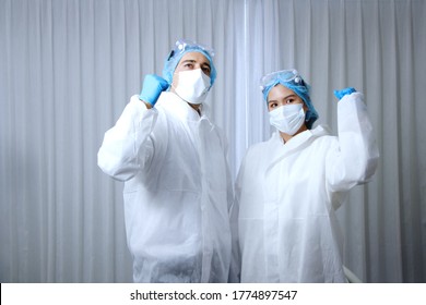 Powerful and energy of Medical team in Personal Protective Equipment or PPE clothing and Healing for patient infected with the Covid-19 virus and treatment in hospital of Thailand - Shutterstock ID 1774897547