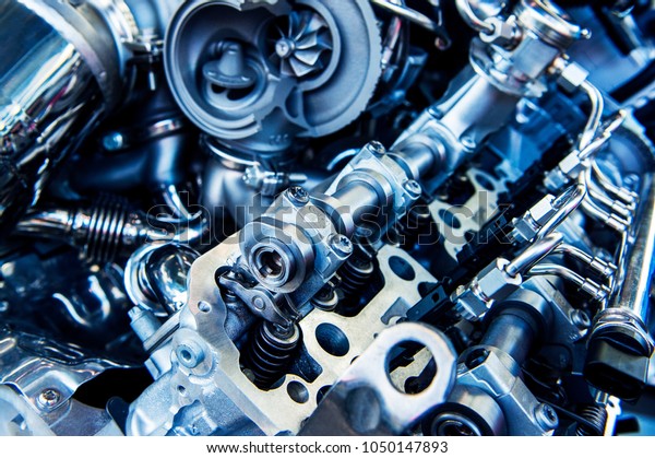 The powerful engine of\
a car. Internal design of engine. Car engine part. Modern powerful\
car engine.