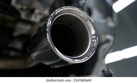 Powerful Exhaust Pipe From The Car. Closeup Of Clean Car Muffler. New Generation Of Sportive Mufflers. Double Car Exhaust Pipe Chromed Made Of Stainless Steel.
