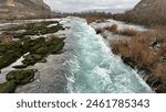 Powerful Flow: Close-Up of Rushing Waters in a Swollen River