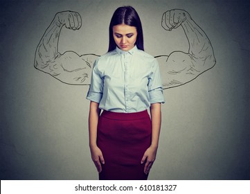 powerful girl reality vs ambition wishful thinking concept. Human face expressions, emotions. Sad woman looking down isolated on gray wall background 