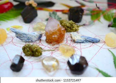 Powerful holistic healing crystal grid kit. Fresh flowers and cannabis, medical marijuana crystal healing grid. Bright and colorful, white background. Macro lens photo, crisp colors. 