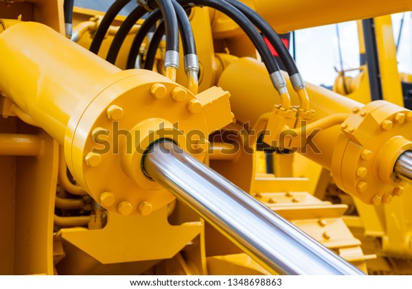 Powerful hydraulic cylinders. The\
main power and driving element for construction\
equipment.
