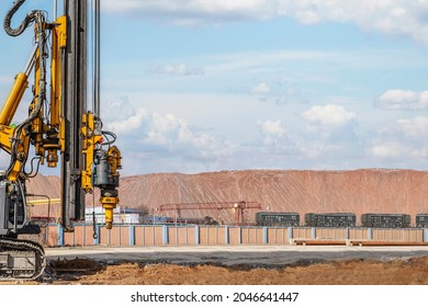 Powerful Hydraulic Drilling Rig On A Construction Site. Installation Of Bored Piles By Drilling. Pile Foundations. Drilling In The Ground