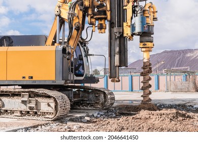 Powerful hydraulic drilling rig on a construction site. Installation of bored piles by drilling. Pile foundations. Drilling in the ground - Shutterstock ID 2046641450