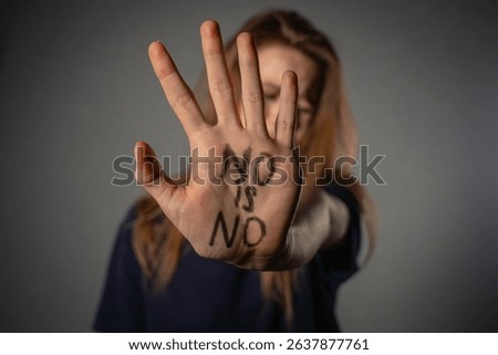 A powerful image emphasizing the importance of consent, with a clear message written on an open hand.