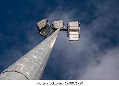 Powerful LED Light On A Aluminum Metal Pole , Cloudy Sky Background. Concept Sport Event, Game. Modern Light Source