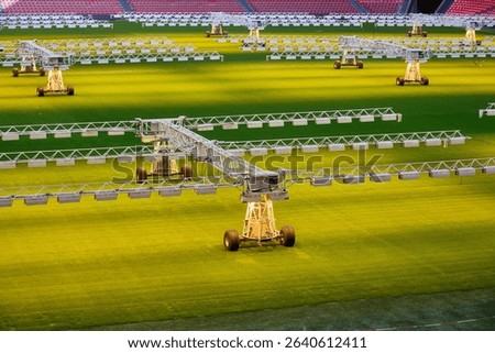 Powerful lighting system nurturing the vibrant green grass of a soccer field within a stadium, ensuring optimal playing conditions