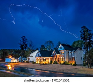 Powerful Lightning Storm Front Passes Over Residential Houses, Focus On The House, Long Exposure