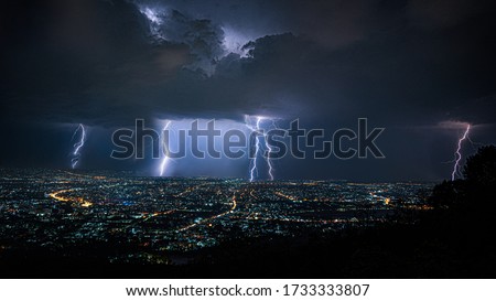 powerful lightning storm over city
