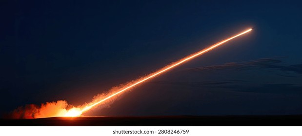 A powerful rocket ascends into the dark night sky, leaving a brilliant, fiery orange trail behind it. The launch is dramatic and awe-inspiring.
