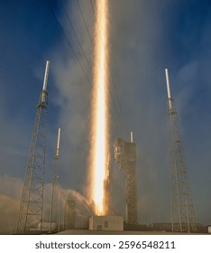 A powerful rocket blasts off from a launchpad, leaving a trail of smoke and fire in its wake. A rocket launching into space. Rocket space ship. Elements of this image furnished by NASA