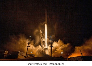 A powerful rocket launch illuminates the night sky at a space center, propelling into space during a clear winter evening. Emergency situation. Elements of this image furnished by NASA