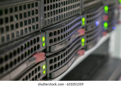 A powerful server is located in the computer room of the computer center. Computing center for data processing. Green LED lights on hard drive slots. Selective focus - Powered by Shutterstock - Get 15% off with code: PIKWIZARD15