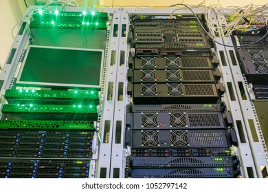 Powerful storage servers work in the server room racks. Hosting services in a modern data center. Computer equipment is located on the technical platform of the Internet provider