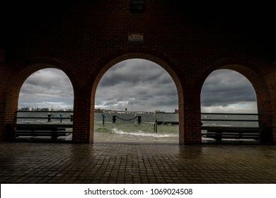 A powerful storm batters Boston Harbor with wind and waves, 