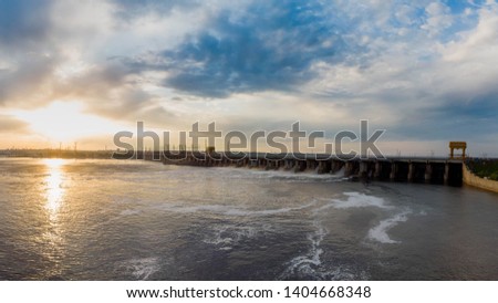Powerful stream of water falls from the shutter in the dam, hydroelectric