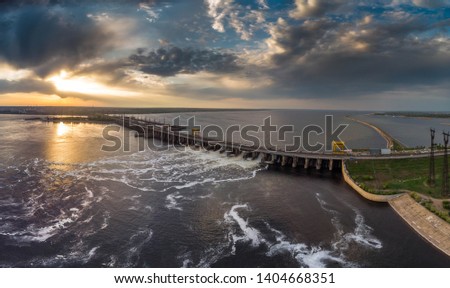 Powerful stream of water falls from the shutter in the dam, hydroelectric