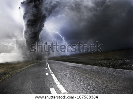 Powerful Tornado - destroying property with lightning in the background
