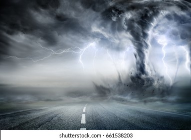 Powerful Tornado On Road In Stormy Landscape
