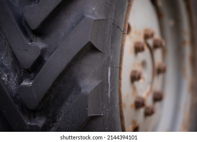 Powerful Tractor Wheel Protector. Selective Focus. Side View.