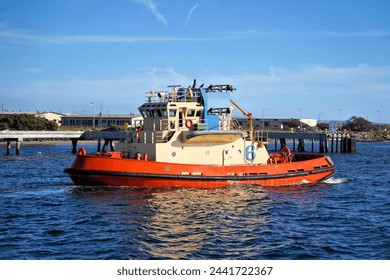 A Powerful Tugboat Traveling Through a Harbor in San Diego