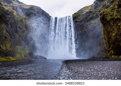 Powerful skógafoss waterfall in iceland, a breathtaking natural wonder with cascading water, mist, and rugged beauty - Powered by Shutterstock