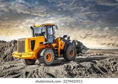 Powerful wheel loader or bulldozer working on a quarry or construction site. Earthworks in construction. Powerful modern equipment for earthworks - Shutterstock ID 2279422911