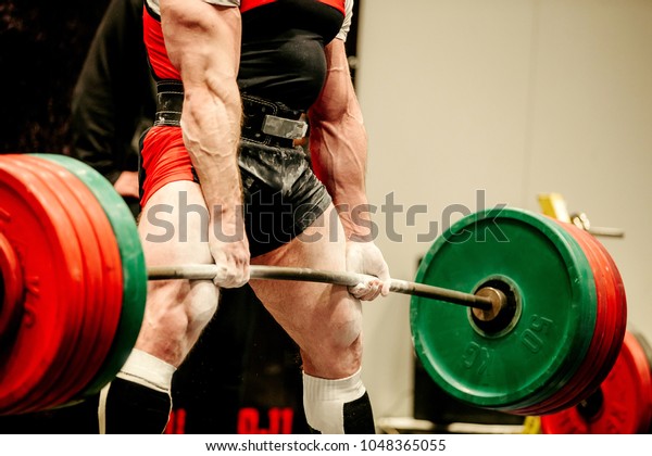 powerlifter heavy weight barbell exercise deadlift in\
powerlifting 