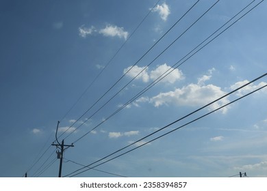 Powerlines on a blue sky day