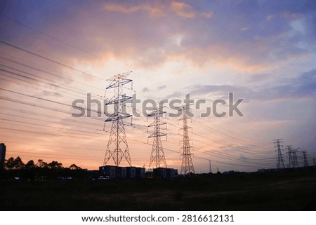 powerlines with vivid sunset in the background