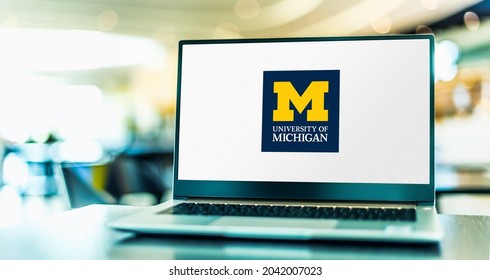 POZNAN, POL - APR 20, 2021: Laptop computer displaying logo of The University of Michigan, a public research university in Ann Arbor, Michigan