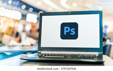 POZNAN, POL - AUG 8, 2020: Laptop computer displaying logo of Adobe Photoshop, a raster graphics editor developed and published by Adobe Inc