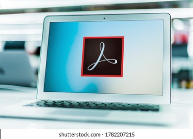 POZNAN, POL - JUN 16, 2020: Laptop computer displaying logo of Adobe Acrobat, a family of application software and Web services developed by Adobe Inc.