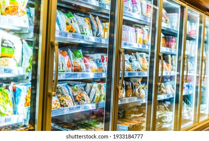 POZNAN, POL - MAR 09, 2021: Food products put up for sale in a commercial refrigerator