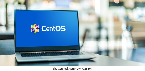 POZNAN, POL - MAR 15, 2021: Laptop Computer Displaying Logo Of CentOS, A Linux Distribution That Provides A Community-supported Computing Platform Functionally Compatible Red Hat Enterprise Linux