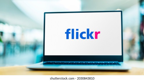 POZNAN, POL - MAY 1, 2021: Laptop computer displaying logo of Flickr, an American image hosting and video hosting service, as well as an online community
