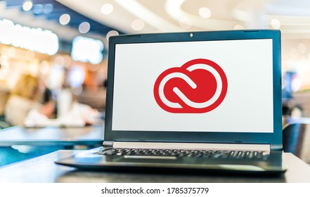 POZNAN, POL - MAY 21, 2020: Laptop computer displaying logo of Adobe Creative Cloud, a set of applications and services from Adobe Systems
