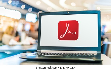 POZNAN, POL - MAY 21, 2020: Laptop computer displaying logo of Adobe Acrobat, a family of application software and Web services developed by Adobe Inc.