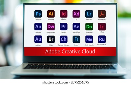 POZNAN, POL - NOV 24, 2021: Laptop computer displaying logo of Adobe Creative Cloud, a set of applications and services from Adobe Systems