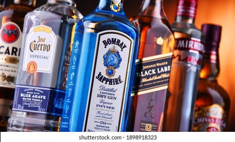 POZNAN, POL - NOV 5, 2020: Bottles of assorted global hard  liquor brands including whiskey, vodka, tequila and gin 