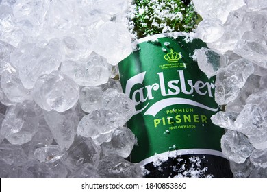 POZNAN, POL - OCT 8, 2020: Bottle of Carlsberg pale lager beer produced by Carlsberg Group, a Danish brewing company founded in 1847 with headquarters located in Copenhagen, Denmark