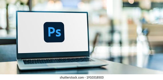 POZNAN, POL - SEP 23, 2020: Laptop computer displaying logo of Adobe Photoshop, a raster graphics editor developed and published by Adobe Inc