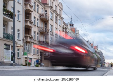 Poznan, Poland - 10.20.2021: Traffic jam, colorful city and cars lights, blurred by speed and motion. A streak of light, trails.
