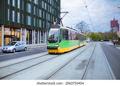 Poznan, Poland - 10.20.2021: tram on the street. Architecture of the city in background. 