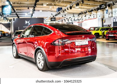 Poznan, Poland, April 05, 2018: Metallic Red Tesla Model X At Poznan International Motor Show, Produced By American Automaker Tesla, Main Shareholder Elon Mus