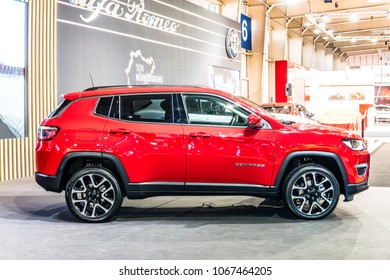 Poznan, Poland, April 05, 2018: metallic red Jeep Compass 4x4 compact crossover SUV at Poznan International Motor Show, Jeep is a brand of American automobiles